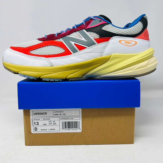 New Balance 990v6 sneaker in white, red, and yellow on blue and brown box, size 13, light wear on soles