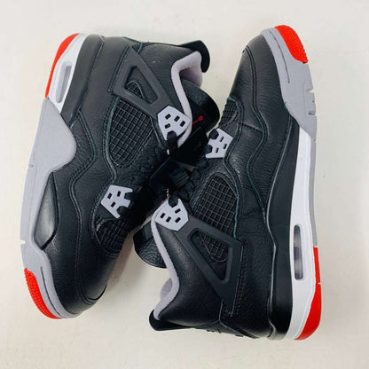 Jordan 4 Retro Bred Reimagined (GS) sneakers, black and red, leather and mesh upper, Jumpman logo, Air-Sole cushioning.