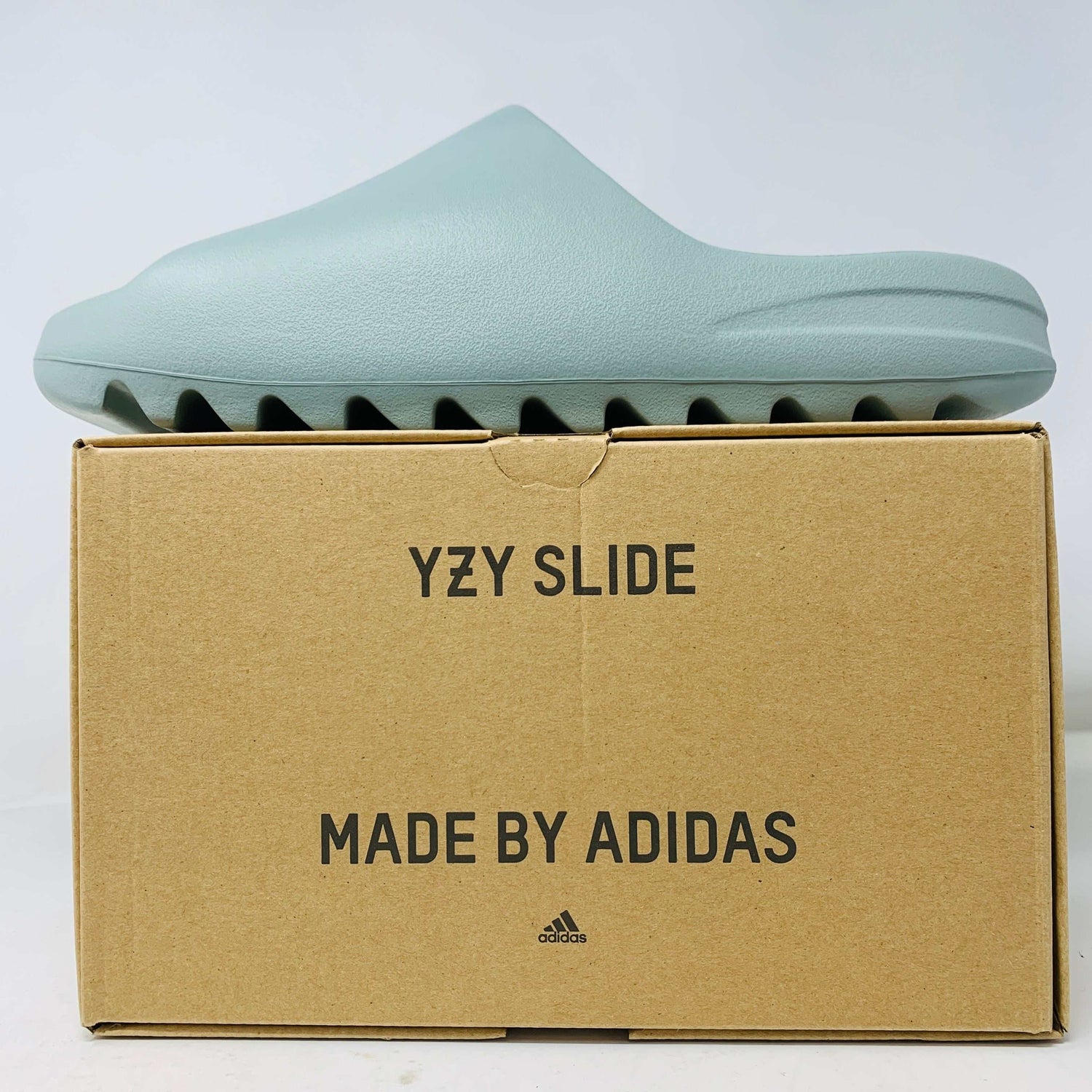 Yeezy Slide Salt 2024, brand new condition, on shoe box, Adidas branding visible.