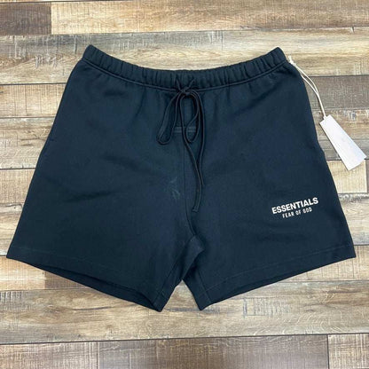 Jet black Fear Of God Essentials soccer fleece shorts with drawstring waistband and logo on front