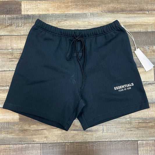 Jet black Fear Of God Essentials soccer fleece shorts with drawstring waistband and logo on front