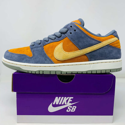 Nike SB Dunk Low Light Carbon Monarch sneakers showcasing suede colorway.