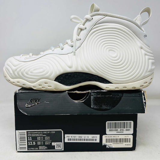 White Nike Air Foamposite One Comme des Garcons Homme Plus sneaker on black Nike box, 2021 model