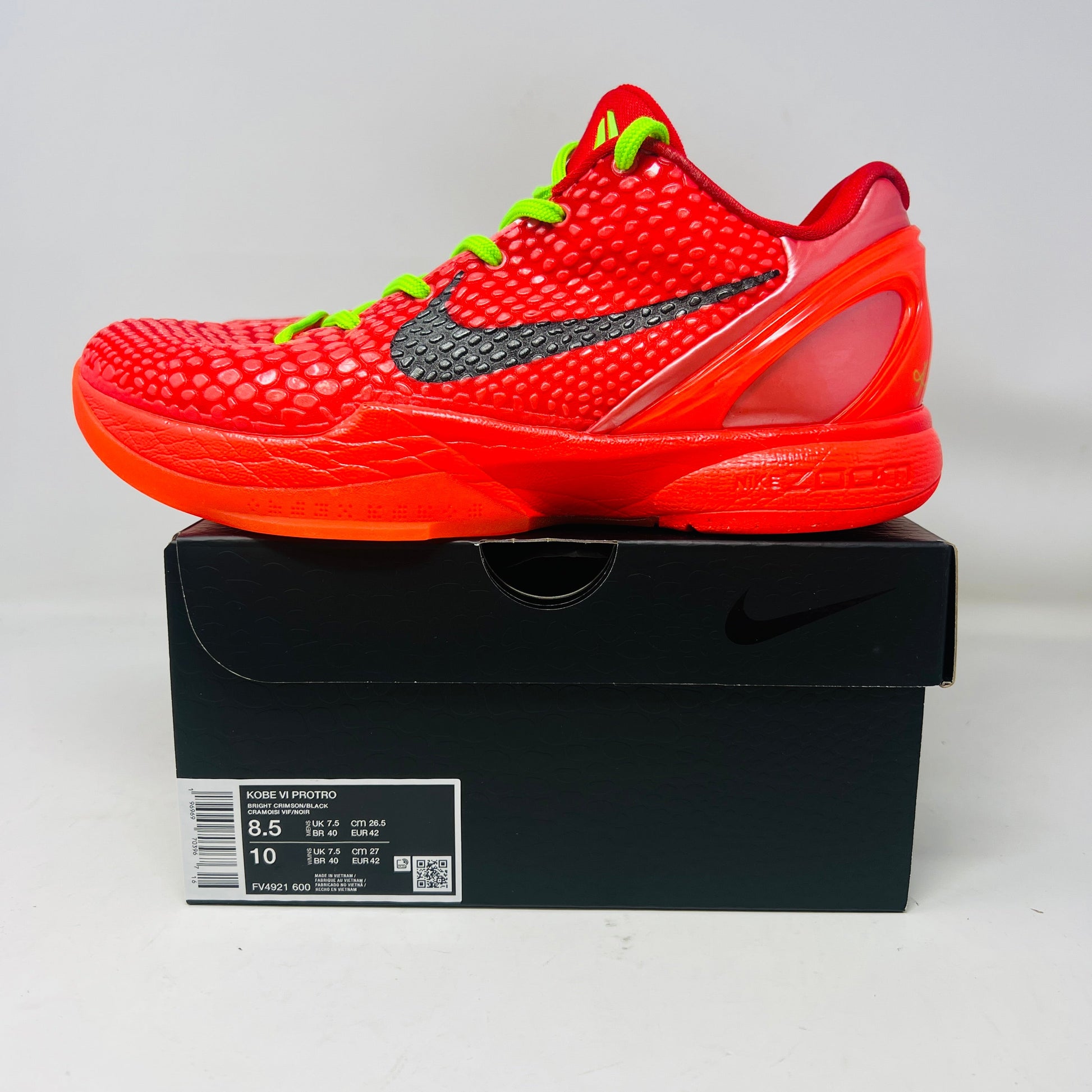 Nike Kobe 6 Protro Reverse Grinch sneakers in red with neon green laces, 2023 model.