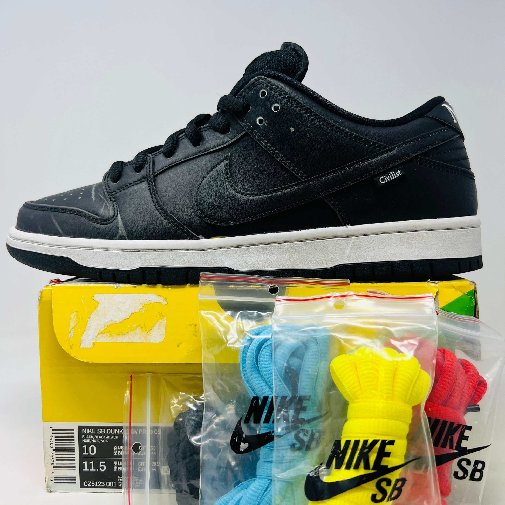 Nike SB Dunk Low Civilist sneakers, black colorway, shown with original box and multiple lace options, condition 8.75/10.