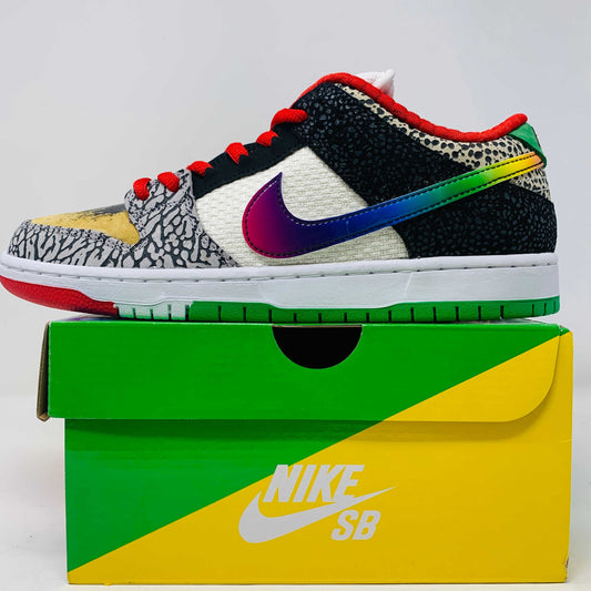The Nike SB Dunk Low What the Paul is a 2021 authentic sneaker featuring varied textures and patterns like elephant print, a gradient swoosh, red laces, and comes in a colorful green, yellow, and white Nike SB box.