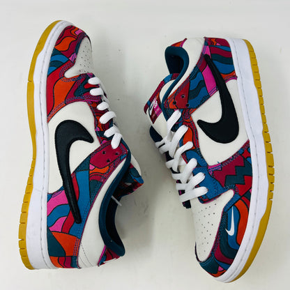 The Nike SB Dunk Low Pro Parra Abstract Art (2021) features a colorful design with abstract red, blue, and purple patterns on a white base. It includes clean uppers with a black swoosh, white laces, and comes in a green/yellow box with extra blue laces for added versatility.