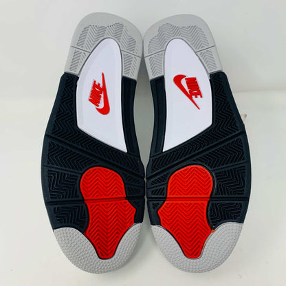 Check out the Jordan 4 White Cement 2016, a white sneaker with black and gray speckles. It features a small red jumping logo, comes in a matching box, and includes the classic 2016 Jordan hang tag for authenticity.