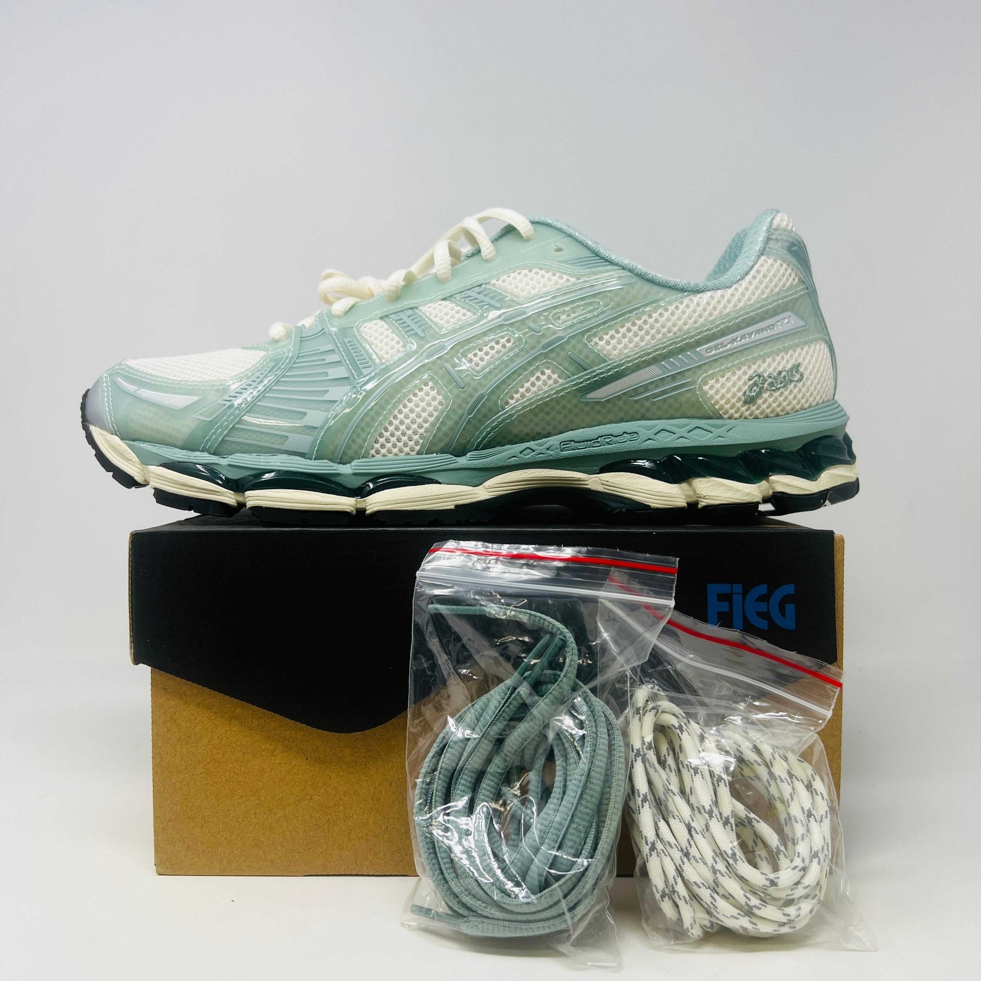 ASICS Gel-Kayano 12.1 Kith Cream Sage sneakers with extra laces, 2024 model.