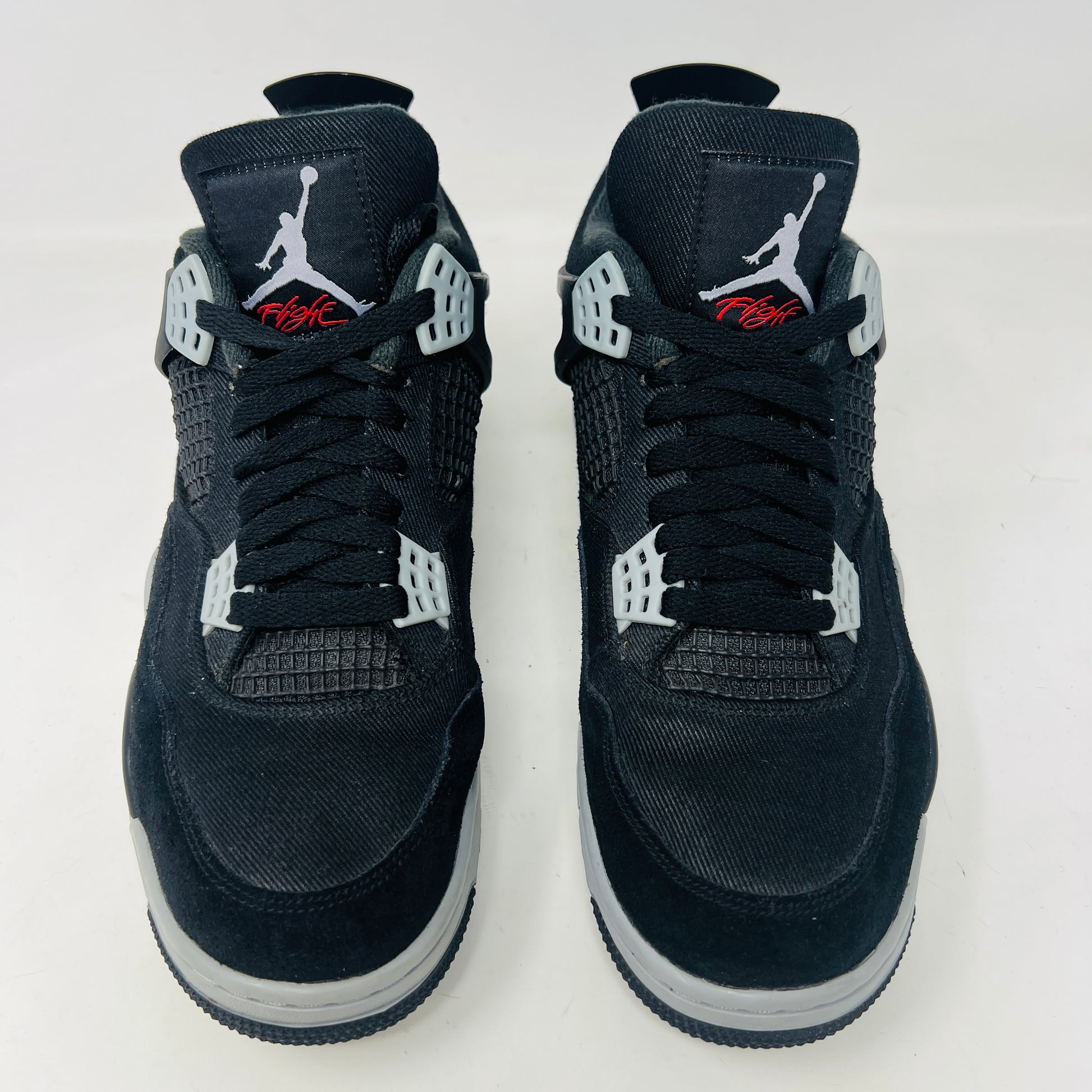 Jordan 4 Retro SE Black Canvas sneakers on box, slight wear.