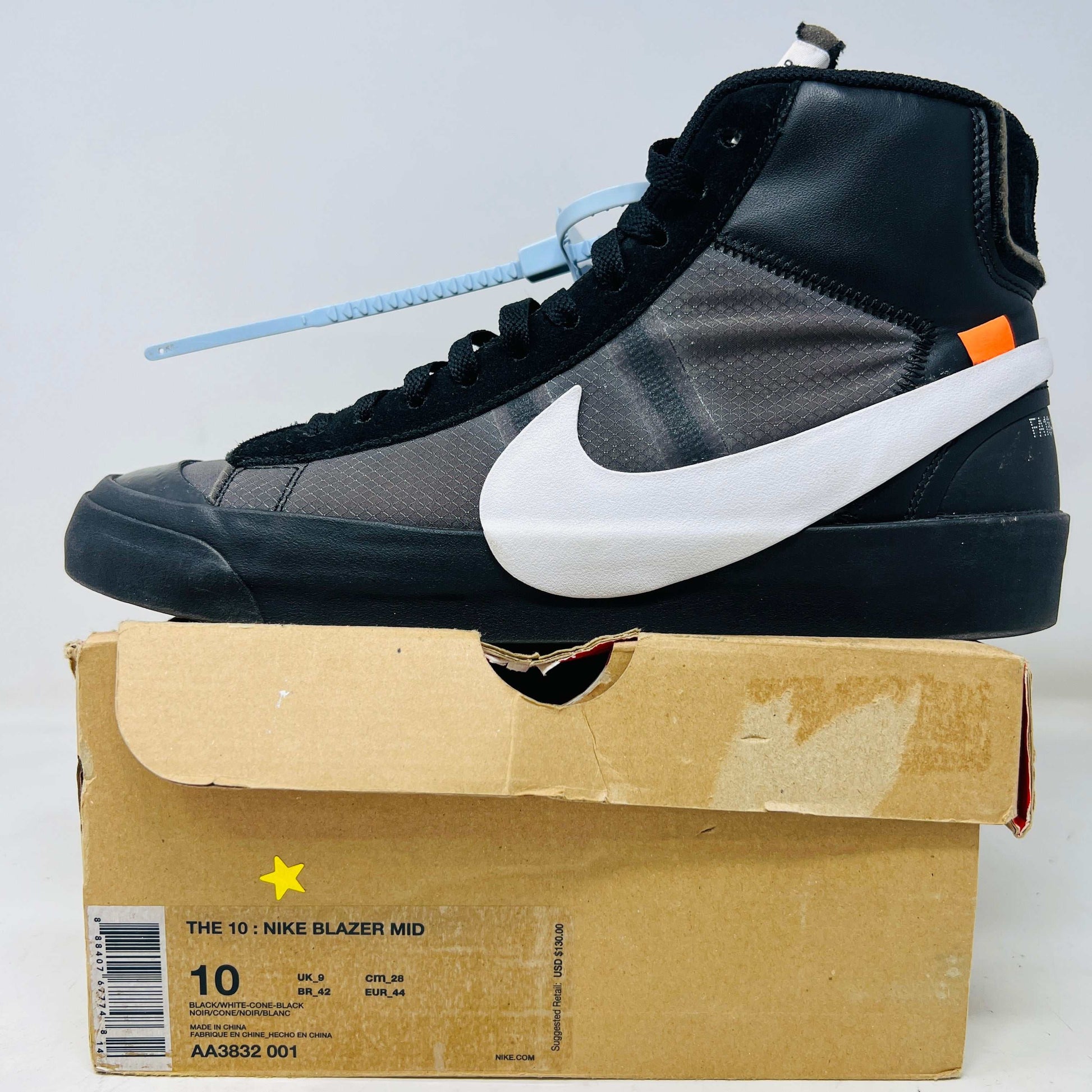 Nike Blazer Mid Off-White Grim Reaper sneaker in black with white swoosh and blue zip tie on cardboard box