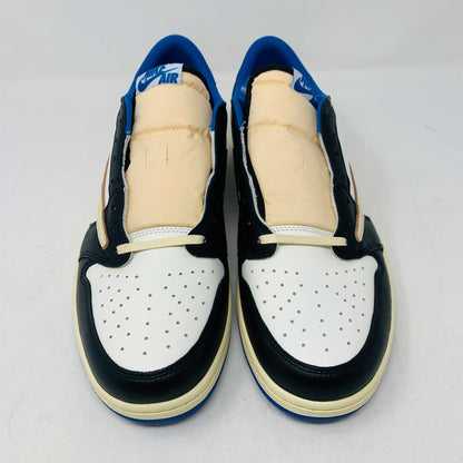 The Jordan 1 Low Travis Scott x Fragment sneakers feature a black and white leather upper with blue accents, a unique beige backward swoosh, and come in a branded Nike box with graphics. These brand-new shoes include an extra set of laces for added versatility.