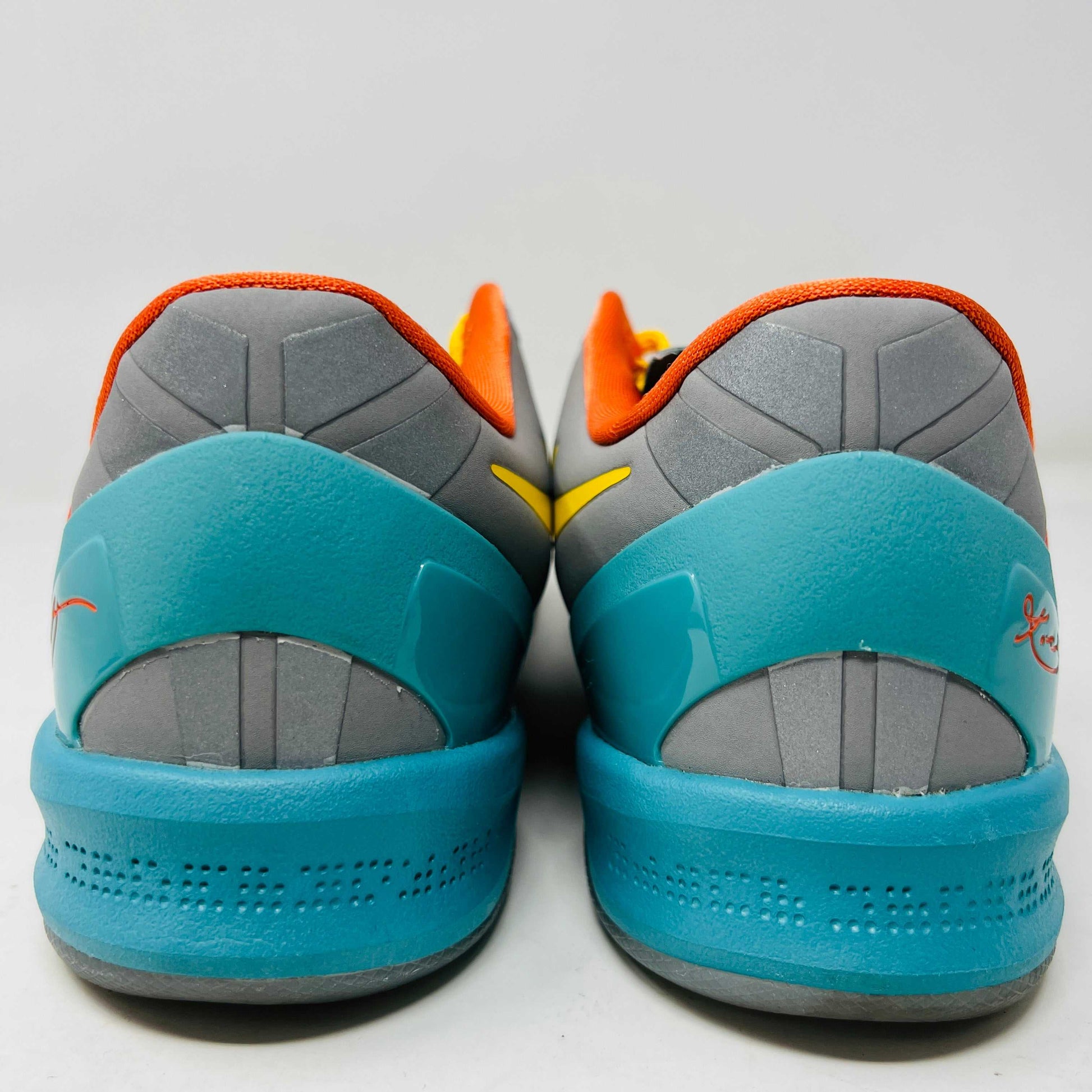 The Nike Kobe 8 Protro Venice Beach (2024) sneakers, featuring vibrant red, blue, yellow, and green brushstroke patterns with clean uppers and yellow laces paired with an orange lining, boast excellent condition at 8.5/10. A distinct logo adorns the gray tongue as they lay side by side on a white background.