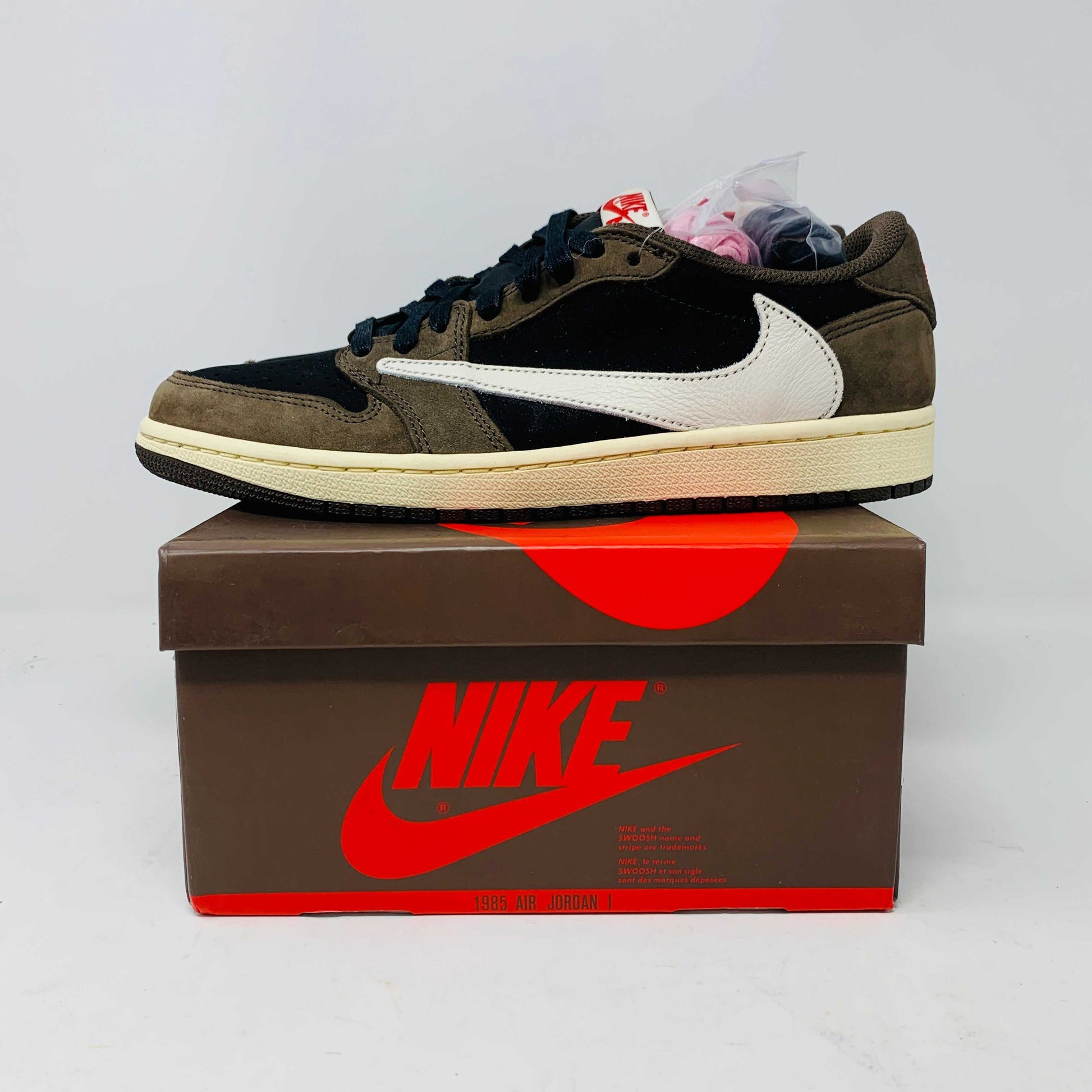 Jordan 1 Low OG Travis Scott Mocha sneakers with original box and extra laces.