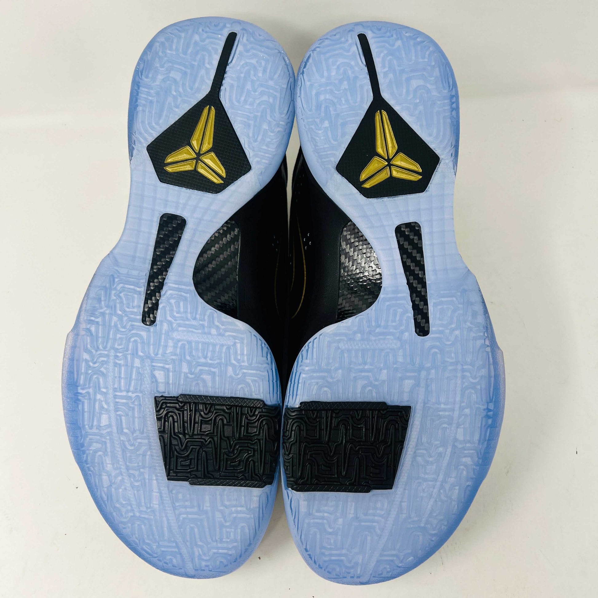 The Nike Kobe 5 Protro Year of the Mamba Eggplant sneakers offer a stylish design with purple and gold colors, black laces, and an authentic tongue logo. They feature perforated side panels, a shiny finish, and include a dust bag for easy storage.