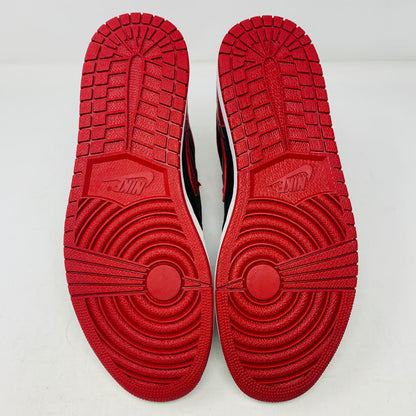 The Jordan 1 High Bred 2016 sneakers, by Jordan, are brand-new black and red high-tops with a white sole. Viewed from above, they showcase an unlaced look with a perforated design on the toe area.