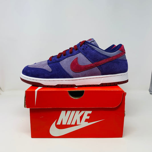 Nike Dunk Low Plum sneakers, 2020 release, brand new condition, placed on a Nike shoe box.